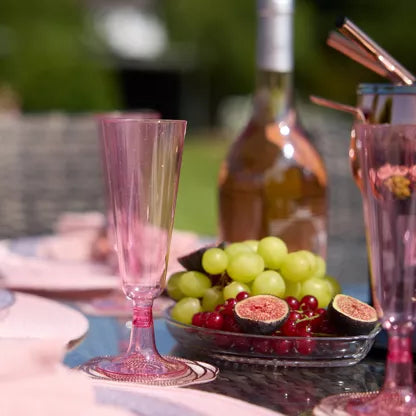 Copa de champán de plástico rosa con purpurina (150 ml)
